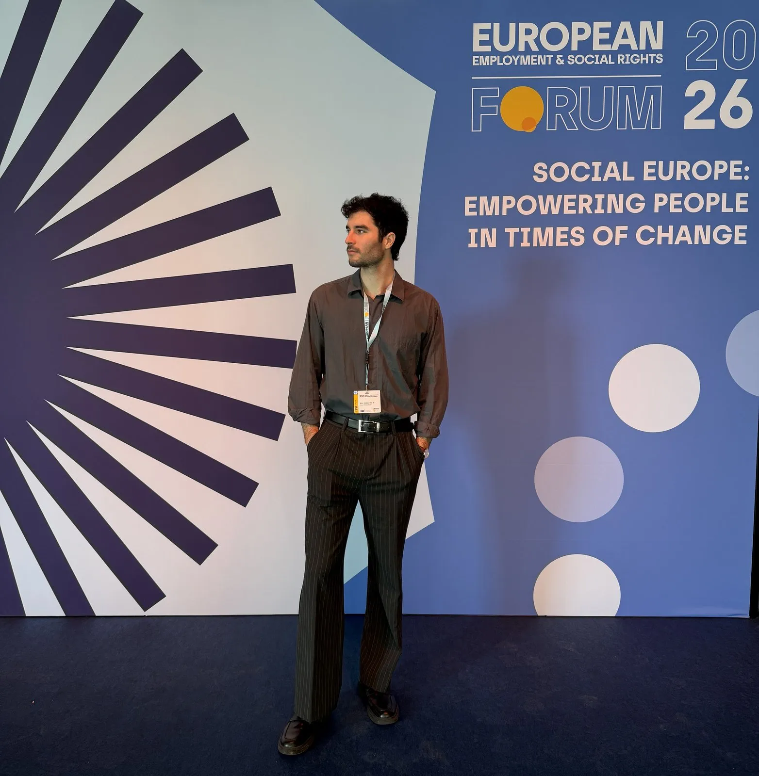 dr. Áron Balázs in front of the European Employment & Social Rights Forum banner